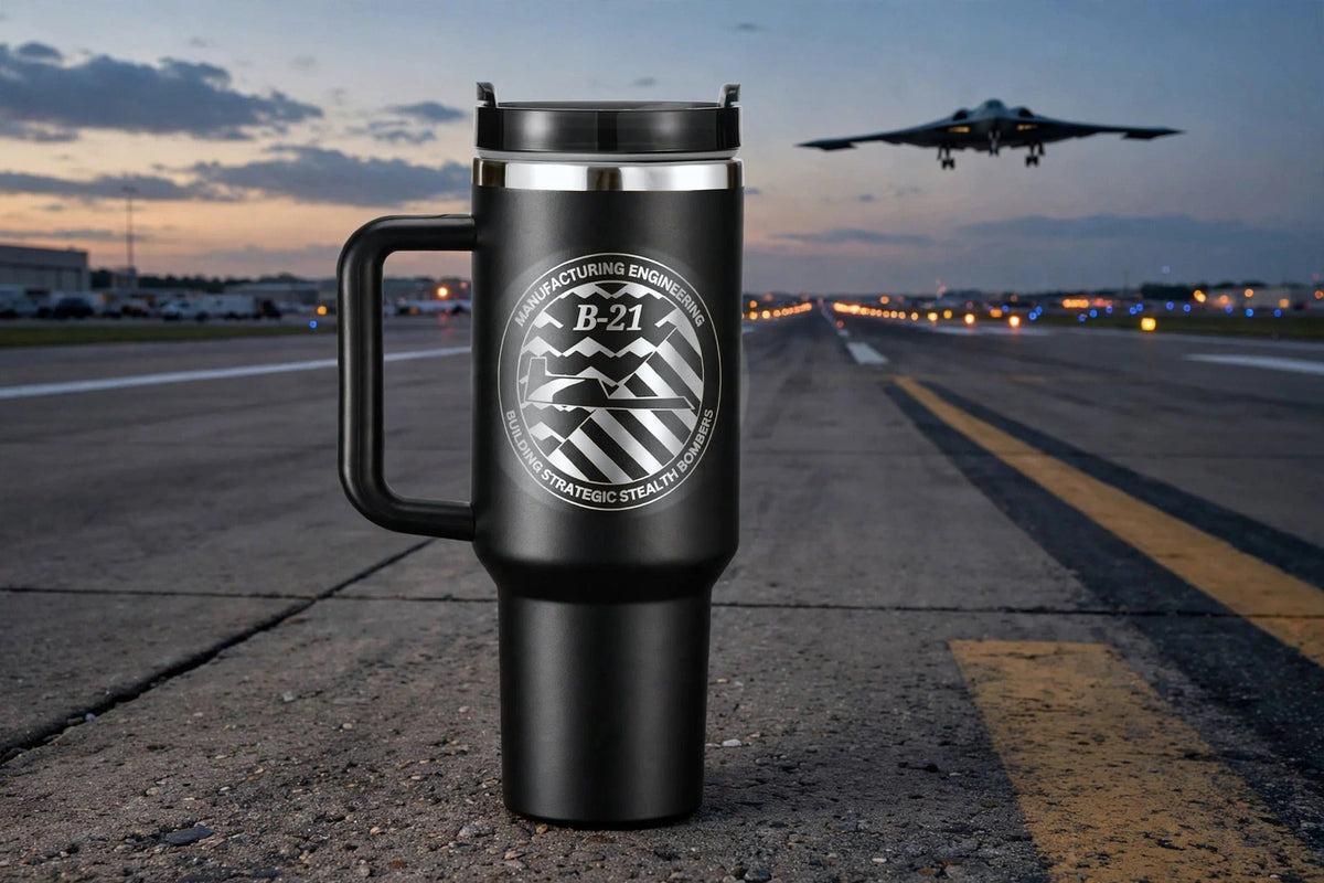 B-21 engraved tumbler on a runway at dawn