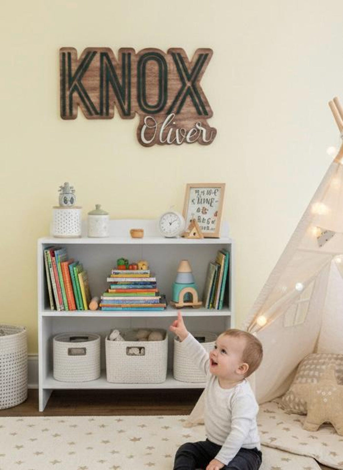 KNOX Oliver name sign above a nursery bookshelf